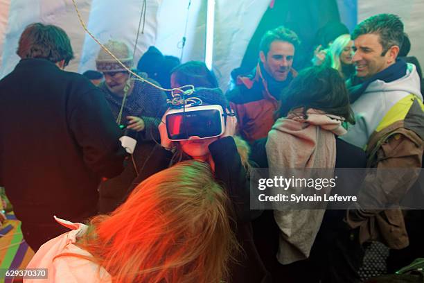 Les Arcs European Film Festival" guests test virtual reality headset during the evening organized by the magazine Variety in the village igloo on...