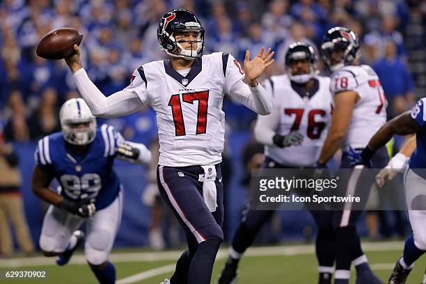 Houston Texans Quarterback Brock Osweiler scrambles out of the pocket to make the pass during an NFL football game between the Houston Texans and the...