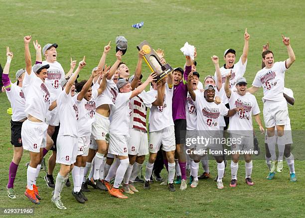 The Stanford Cardinal players hold up the championship trophy during the NCAA Men's College Cup National Championship soccer match between the Wake...