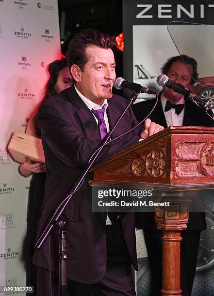 Charlie Sheen accepts the Cigar Smoker of the Year Runner-Up award at the Snow Queen Cigar Smoker of the Year awards at Boisdale of Canary Wharf on...