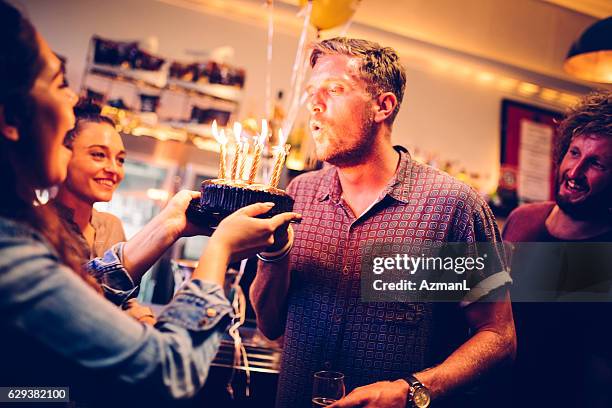 celebrating in a pub - verjaardagskaars stockfoto's en -beelden