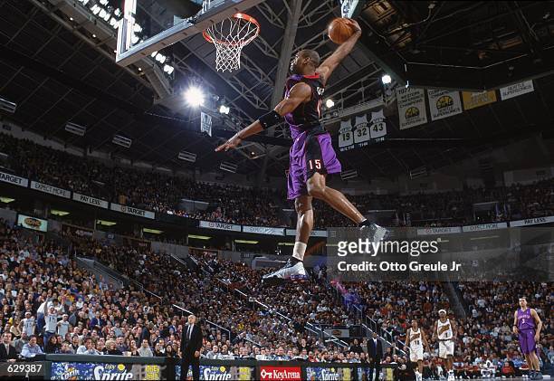 Vince Carter of the Toronto Raptors makes a slam dunk during the game against the Seattle SuperSonics at the Key Arena in Seattle, Washington. The...