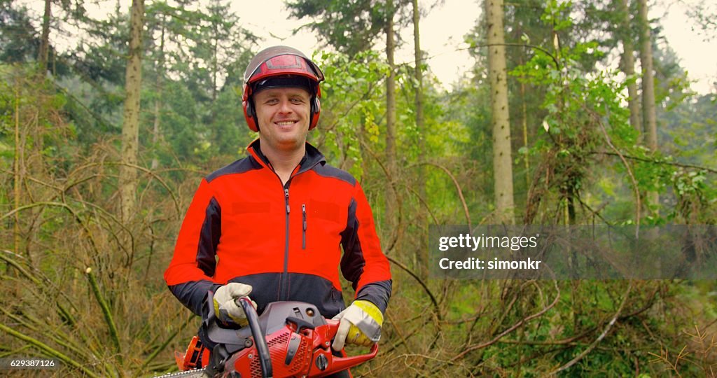 Man holding chainsaw