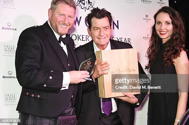 Charlie Sheen accepts the Cigar Smoker of the Year Runner-Up award at the Snow Queen Cigar Smoker of the Year awards at Boisdale of Canary Wharf on...