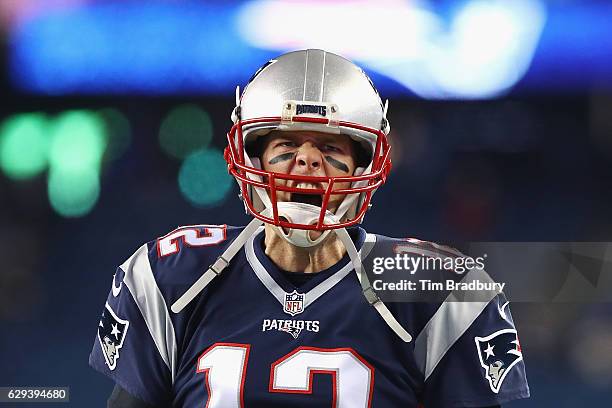 Tom Brady of the New England Patriots reacts as he runs on the field prior to the game against the Baltimore Ravens at Gillette Stadium on December...