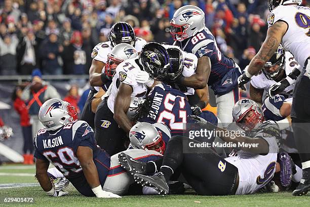 LeGarrette Blount of the New England Patriots rushes for a 1-yard touchdown during the first quarter against the Baltimore Ravens at Gillette Stadium...