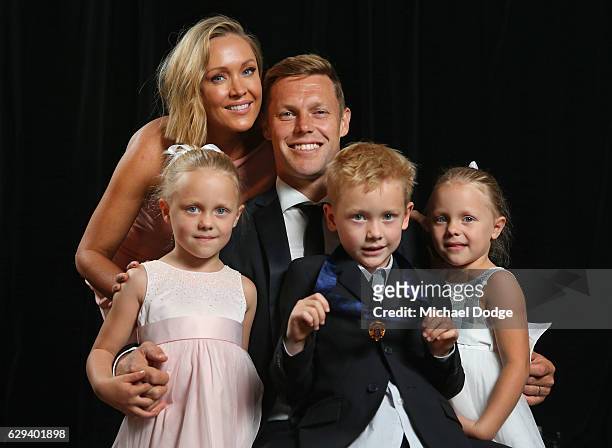 Sam Mitchell of the West Coast Eagles poses with wife Lyndall, daughters Emmy and Scarlett and son Smith after receiving his Browlnow during the 2012...