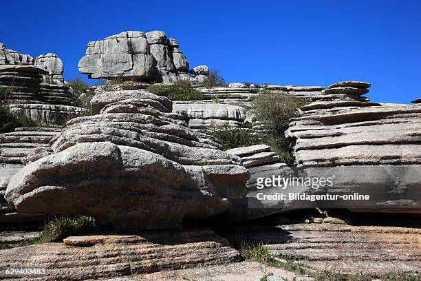 Bizarre rock formations in National Park El Torca, Paraje Natural Torcal de Antequera, El Torcal de Antequera is a nature reserve in the Sierra del...