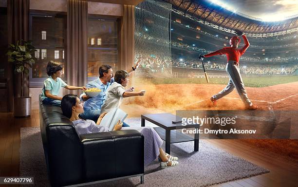 family with children cheering and watching baseball game on tv - baseball fans stock pictures, royalty-free photos & images
