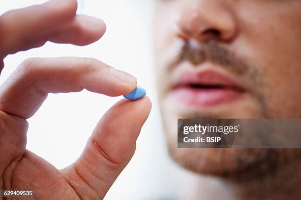 Man taking Viagra.