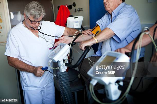 Physiotherapist Team in hospital, Haute-Savoie, France, cardiac rehabilitation session run by a physiotherapist. This session is for patients who...