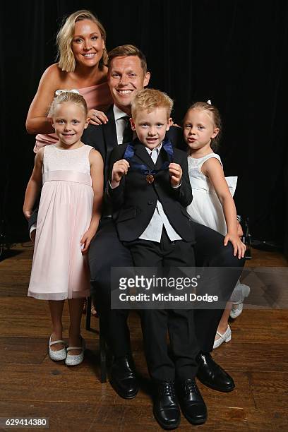 Sam Mitchell of the West Coast Eagles poses with wife Lyndall, daughters Emmy and Scarlett and son Smith after receiving his Browlnow during the 2012...