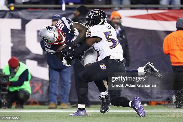 Martellus Bennett of the New England Patriots makes a touchdown reception against Zachary Orr of the Baltimore Ravens during the third quarter of...