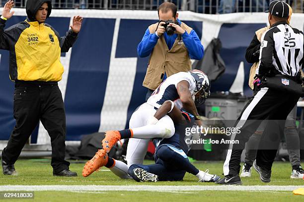 Aqib Talib of the Denver Broncos wrestles Harry Douglas of the Tennessee Titans at Nissan Stadium, Nashville, TN December 11, 2016.