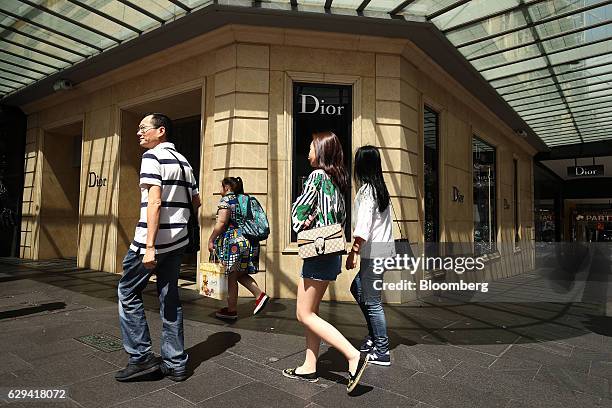 Pedestrians walk past a Christian Dior SE store in Sydney, Australia, on Saturday, Dec. 10, 2016. Australia is scheduled to release consumer...