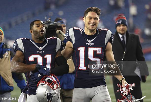 Malcolm Butler and Chris Hogan of the New England Patriots react as they walk off the field after defeating the Baltimore Ravens 30-23 at Gillette...