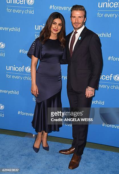 Priyanka Chopra and David Beckham attend UNICEF's 70th anniversary event at United Nations Headquarters on December 12, 2016 in New York City. / AFP...