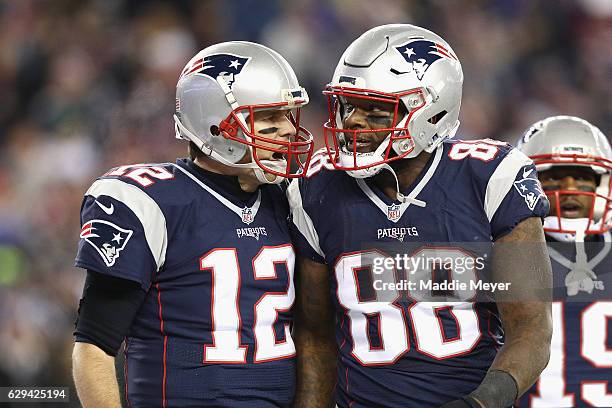 Tom Brady of the New England Patriots reacts with Martellus Bennett after scoring a touchdown during the third quarter against the Baltimore Ravens...