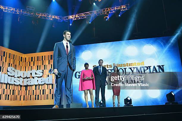 Olympic Swimmer Michael Phelps speaks onstage during the Sports Illustrated Sportsperson of the Year Ceremony 2016 at Barclays Center of Brooklyn on...