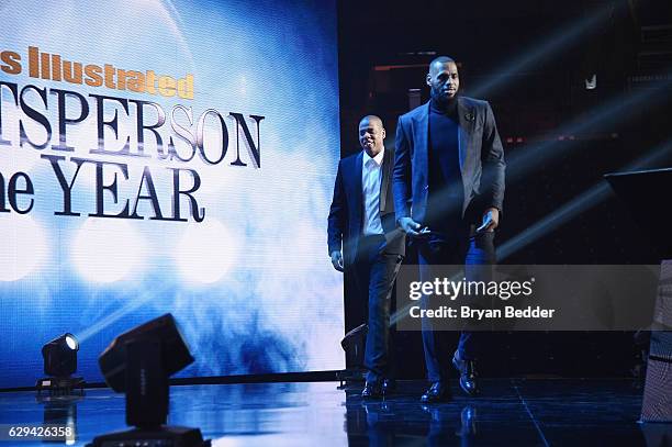 LeBron James and Jay Z walk onstage during the Sports Illustrated Sportsperson of the Year Ceremony 2016 at Barclays Center of Brooklyn on December...