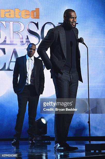 LeBron James and Jay Z speak onstage during the Sports Illustrated Sportsperson of the Year Ceremony 2016 at Barclays Center of Brooklyn on December...