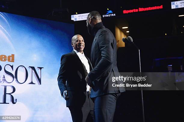 LeBron James and Jay Z speak onstage during the Sports Illustrated Sportsperson of the Year Ceremony 2016 at Barclays Center of Brooklyn on December...