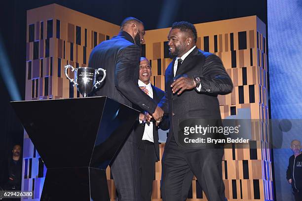 LeBron James, Jay Z, and David Ortiz embrace onstage during the Sports Illustrated Sportsperson of the Year Ceremony 2016 at Barclays Center of...