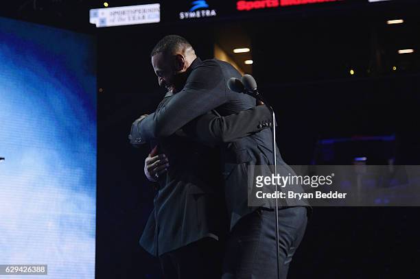 LeBron James and Jay Z embrace onstage during the Sports Illustrated Sportsperson of the Year Ceremony 2016 at Barclays Center of Brooklyn on...