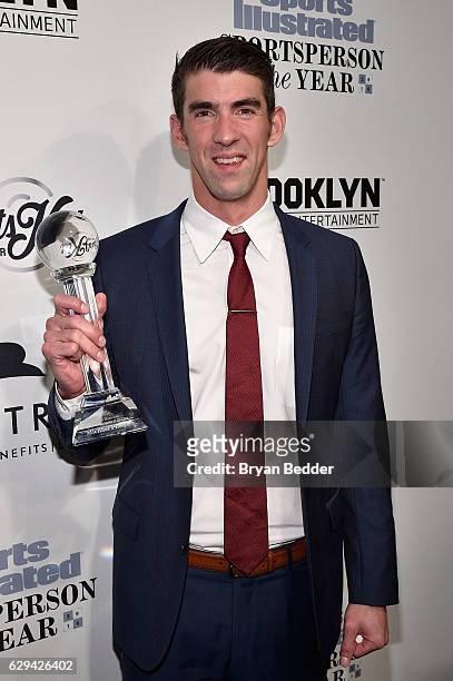 Michael Phelps poses with his award during the Sports Illustrated Sportsperson of the Year Ceremony 2016 at Barclays Center of Brooklyn on December...