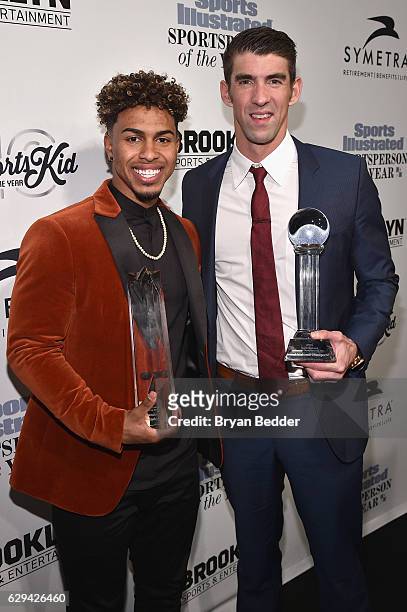 Francisco Lindor and Michael Phelps pose with their awards during the Sports Illustrated Sportsperson of the Year Ceremony 2016 at Barclays Center of...