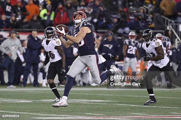 Chris Hogan of the New England Patriots makes a 79-yard touchdown reception during the fourth quarter against the Baltimore Ravens at Gillette...