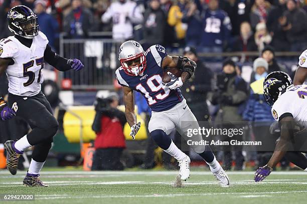 Malcolm Mitchell of the New England Patriots runs with the ball during the first half against the Baltimore Ravens at Gillette Stadium on December...