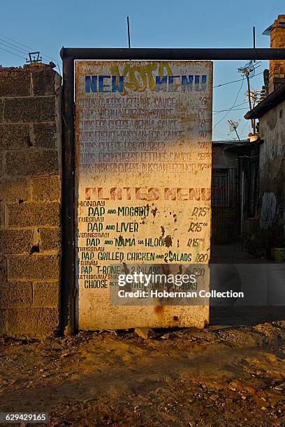 Detail of Spaza shop food menu in Kliptown, Soweto.