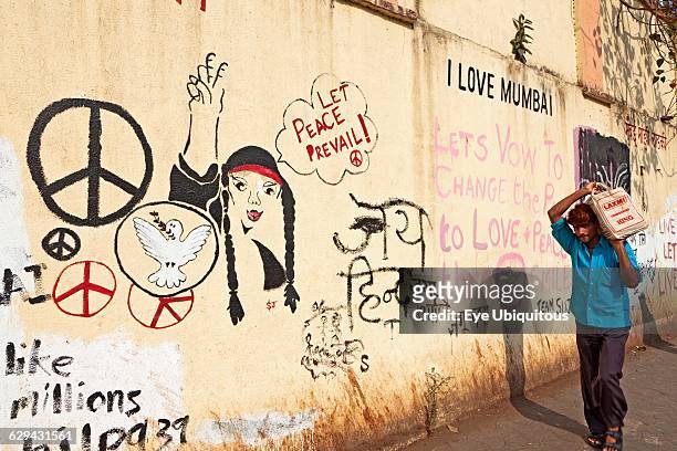 India. Maharashtra. Mumbai. 'Art wall' covered with slogans. Graffiti and drawings to encourage Mumbai people to be positive and upbeat and...