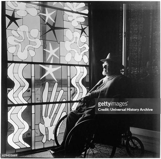 Henri Matisse in Wheelchair Looking at Stained Glass at Chapel of the Rosary, Vence, near Nice, France, 1941.