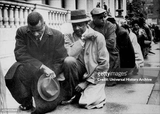 Black Protesters Kneeling Before City Hall, Birmingham, Alabama, USA, Minutes Before Being Arrested for Parading Without a Permit, April 6, 1963.