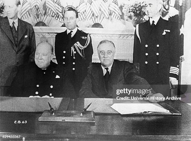 Prime Minister Winston Churchill and President Franklin D. Roosevelt at Conference Table, White House, Washington, DC, Dec. 22, 1941.