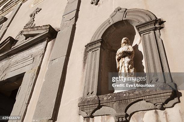 Italy. Tuscany. Lucca. Barga. Statue on the facade of Chiesa del St Crocifisso.