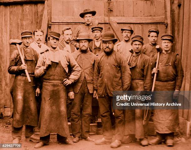 Group of Workers, Four Holding Sledgehammers, Albumen Photograph, circa 1880.