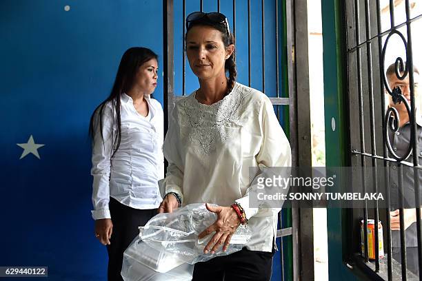 Australian national Sara Connor walks to a holding cell for her trial at a court in Denpasar on Indonesia's resort island of Bali on December 13,...