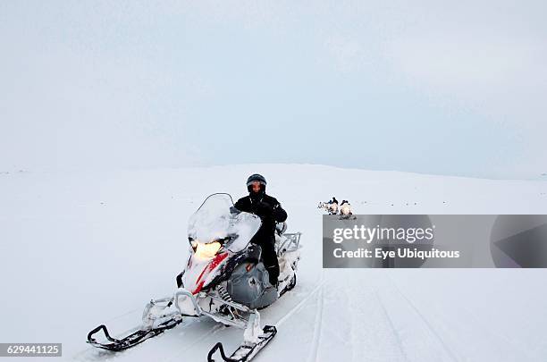 Iceland. Langjokull Glacier with tourists on a ski doo trip.