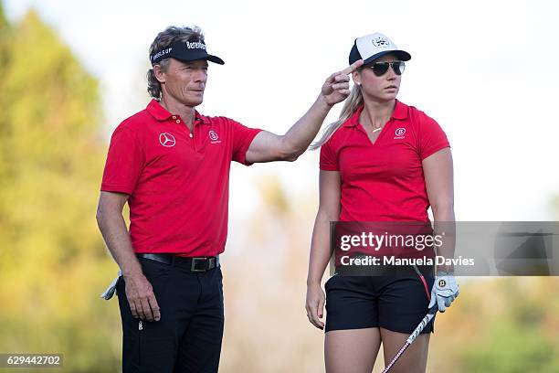 Bernhard and Christina Langer of Germany get ready to hit a shot on the 18th fairway during the first round of the PNC Father/Son Challenge at The...