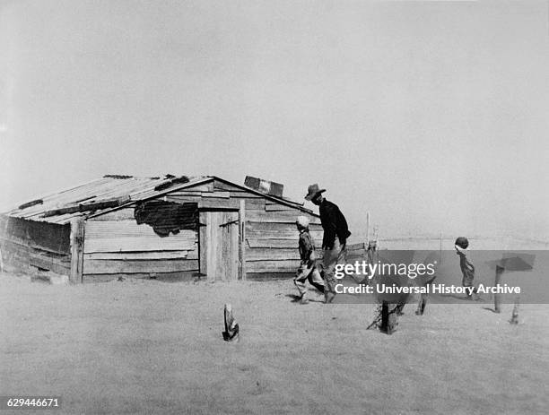 Farmer and his Two Sons During Dust Storm, Cimarron County, Oklahoma, USA by Arthur Rothstein, 1936.