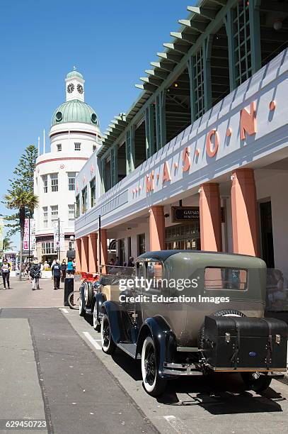 Classic vintage cars outside the Masonic Hotel in the art deco town of Napier New Zealand.