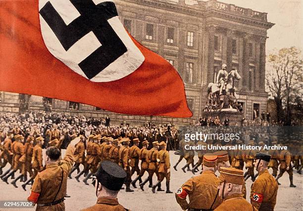 Adolf Hitler Saluting Marching Nazi Soldiers, Braunschweig, Germany, 1931.