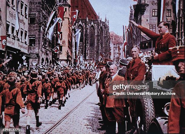 Hitler Youth March before their Leader, Baldur von Shirach, during Rally, Nuremberg, Germany, 1933.