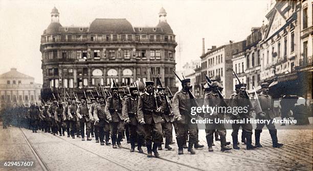 German Troops Marching in Brussels, Belgium, WWI Postcard, circa 1914.