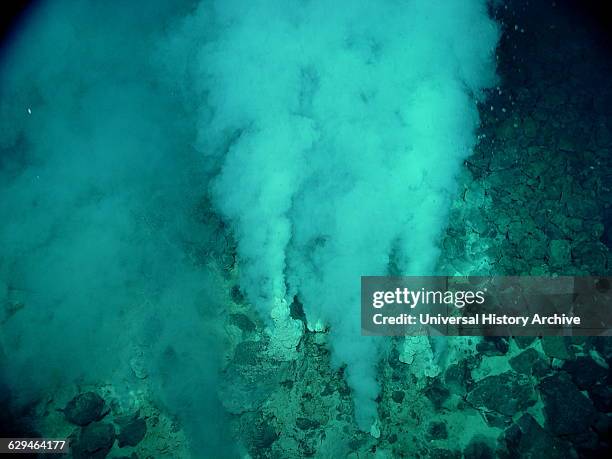 White flocculent mats in and around the extremely gassy high temperature with white smokers at the Champagne Vent Site. Mariana Arc region, Western...