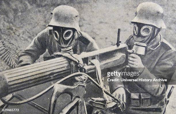 German soldiers in masks use machine gun, France 1915. News Photo - Getty Images
