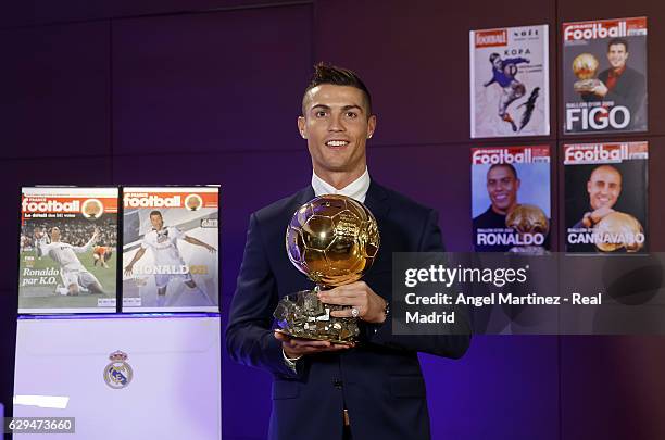 Cristiano Ronaldo of Real Madrid poses with the Ballon D'Or 2016 trophy at Estadio Santiago Bernabeu on December 12, 2016 in Madrid, Spain.